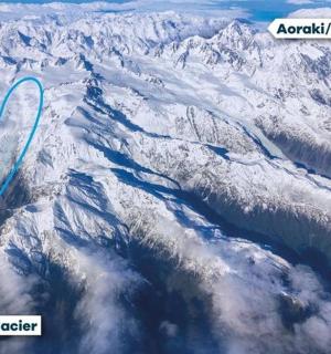 an aerial view of a snow covered mountain