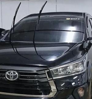 a black van is parked in a garage