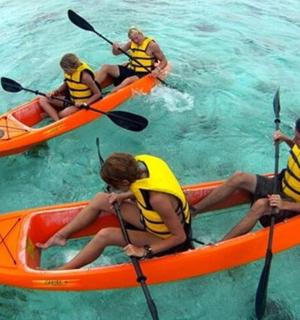 a group of people in kayaks in the water