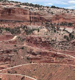 a view of a canyon with a dirt road on it