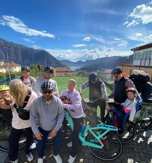 a group of people posing for a picture with their bikes