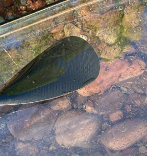 a spatula sitting on top of some rocks