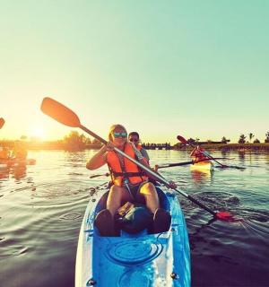a group of people in a kayak on the water