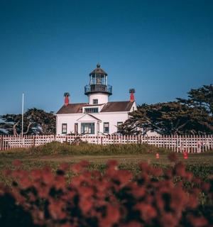 a lighthouse on top of a white house