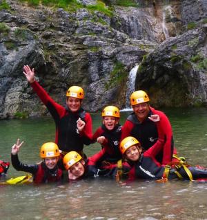 a group of people in the water on a river