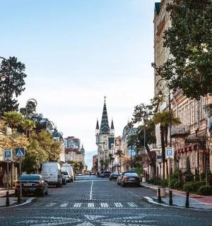 a city street with cars parked on the street