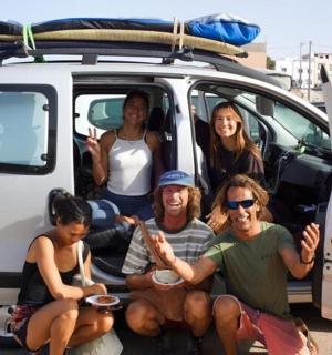 a group of people sitting in the back of a car