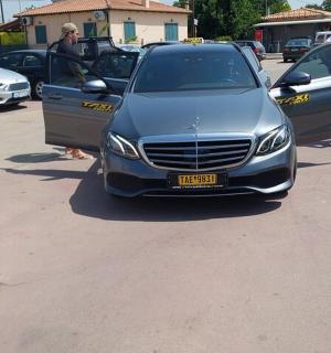 a silver car parked in a parking lot