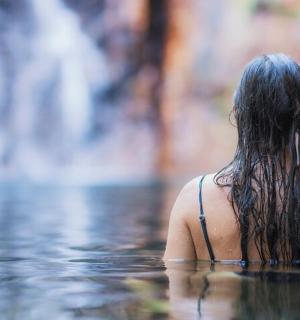 a woman is standing in the water