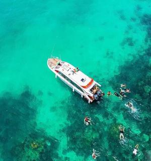 a boat in the water with people on it
