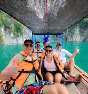 a group of people on a boat in the water