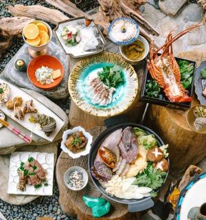 a table topped with plates of food on top thereof