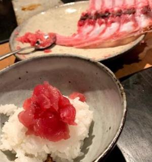 a bowl of food with a piece of cake on a table