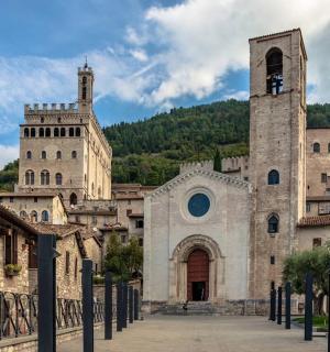 an old building with a clock tower and a church