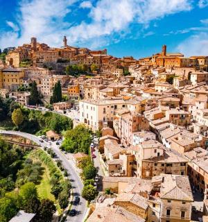 an aerial view of a town on a mountain