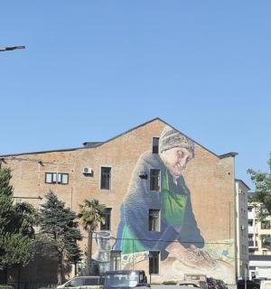 a mural of a man on the side of a building