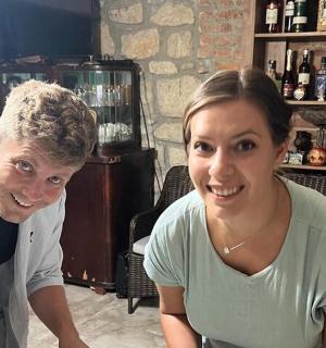 a man and a woman sitting at a bar