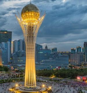 a view of a tower in a city at night