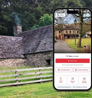 a cell phone taking a picture of a house