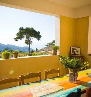 a dining room with a table and a large window