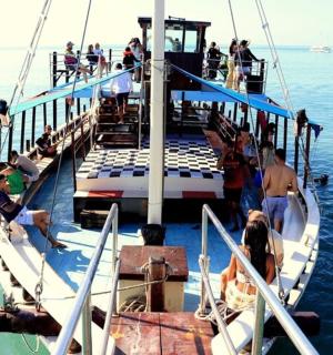 a group of people on a boat in the water