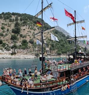 a group of people on a boat in the water