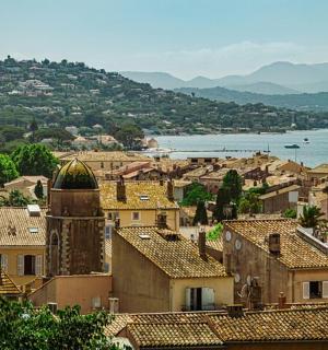 a view of a town with buildings and the water