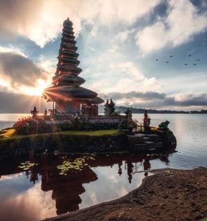 a temple in the middle of a body of water