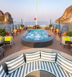 a deck of a cruise ship with a swimming pool