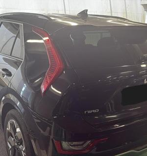 a black car parked in a parking lot