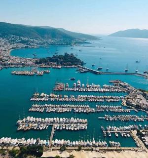an aerial view of a harbor with boats in the water
