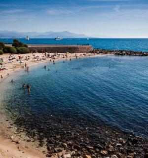 a group of people in the water at a beach