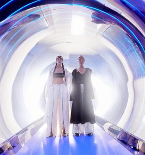 two women are standing in a tunnel
