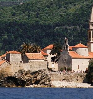 a group of people standing in front of a church
