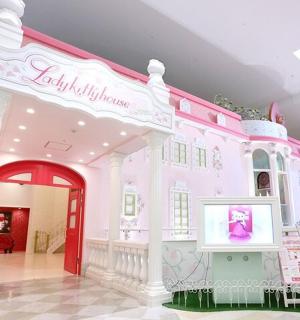 a room with a pink building with a tv in it