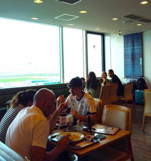a group of people sitting at a table in a restaurant