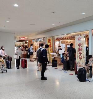 a group of people standing in a shopping mall