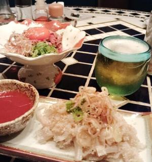 a table with a plate of food and a drink
