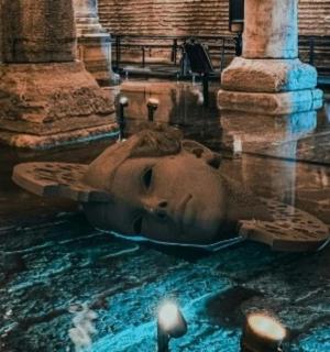 a statue of a face in the middle of a building