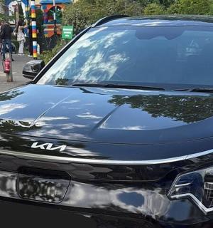 a black car parked on the side of a street