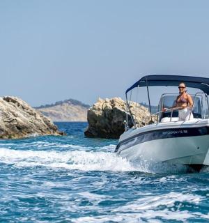 a man and a woman on a boat in the water