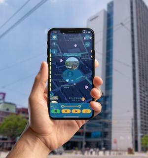 a person holding a cell phone in their hand