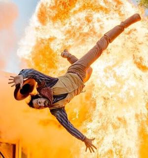 a man is falling off of a building