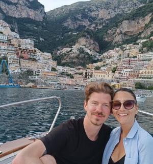 a man and a woman sitting on a boat