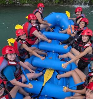 a group of people in a raft on a river