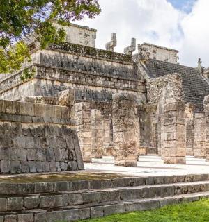 ancient ruins of a building with stone steps