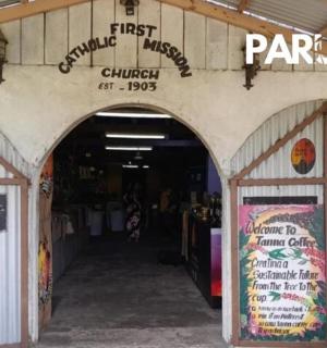 an entrance to a store with graffiti on the wall