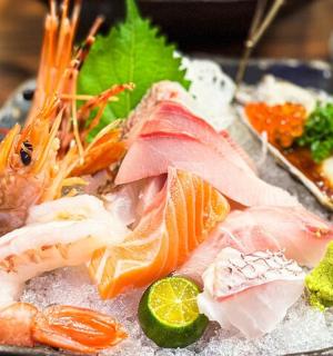 a plate of food with seafood and vegetables on a table