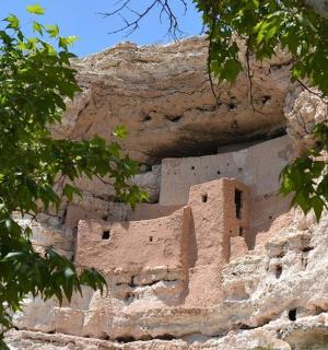 a building on the side of a rocky mountain