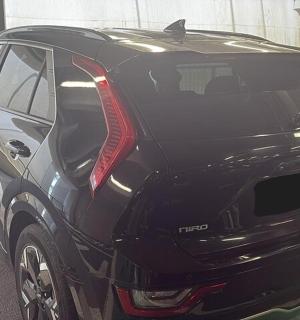 a black car parked in a parking lot